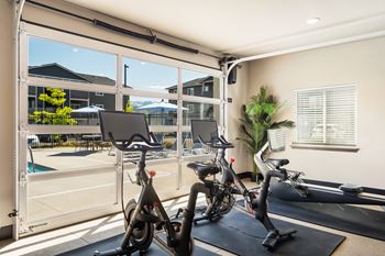 The gym at the enclave at woodbridge apartments in sugar land, tx